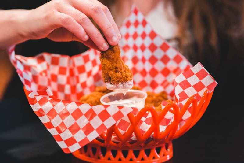 Dave's hot chicken loaded crinkle fries with seasoning